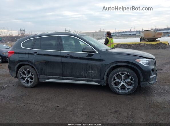 WBXHT3C30GP883734 2016 BMW X1 Black Vista interior trasera