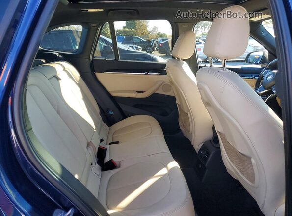WBXHT3C37GP884279 2016 BMW X1 Blue Widok wnętrza z tyłu