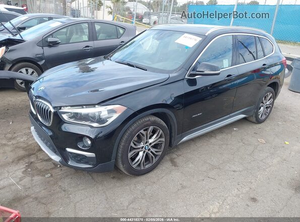 WBXHT3Z34G4A49252 2016 BMW X1 Черный Передняя левая четверть