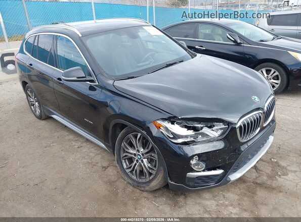 WBXHT3Z34G4A49252 2016 BMW X1 Черный Передняя правая четверть