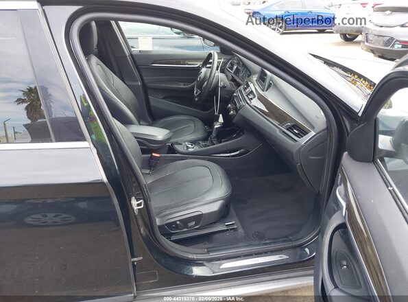 WBXHT3Z34G4A49252 2016 BMW X1 Черный Вид салона спереди