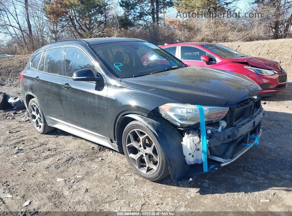 WBXHU7C31H5H37962 2017 BMW X1 Черный Передняя правая четверть