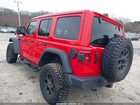 2024 Jeep Wrangler 4-door Willys 4x4 Red vin: 1C4PJXDG8RW315344
