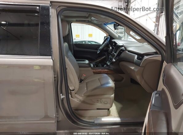 1GNSKCKC7GR180327 2016 CHEVROLET TAHOE Коричневый Вид салона спереди