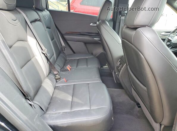 1GYFZBR44RF199057 2024 CADILLAC XT4 Черный Вид задней части салона
