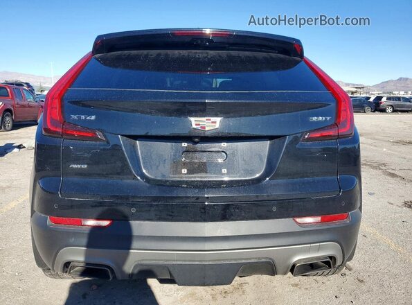 1GYFZDR4XNF131075 2022 CADILLAC XT4 Черный Вид сзади