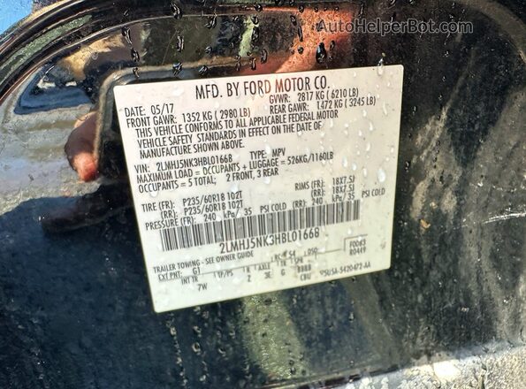 2LMHJ5NK3HBL01668 2017 LINCOLN MKT Черный Вид задней части салона