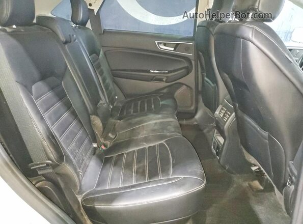 2FMPK4J99KBC34230 2019 FORD EDGE Серебряный Вид задней части салона