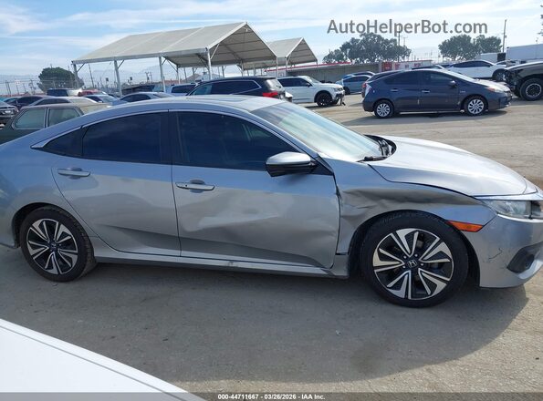 2HGFC1F35GH653228 2016 HONDA CIVIC Серебряный Вид задней части салона