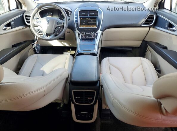 2LMPJ6JR1JBL40964 2018 LINCOLN MKX Золотой Вид панели приборов