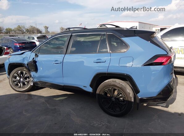 2T3E6RFV7RW063083 2024 TOYOTA RAV4 HYBRID Light Blue Вид задней части салона