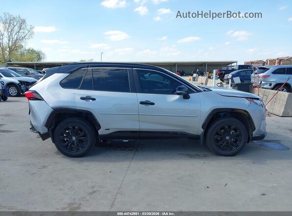 2T3E6RFV8RW069541 2024 TOYOTA RAV4 HYBRID Silver Вид задньої частини салону
