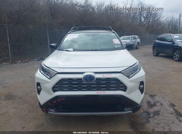 2T3EWRFV0KW027239 2019 TOYOTA RAV4 HYBRID White Vista interior trasera