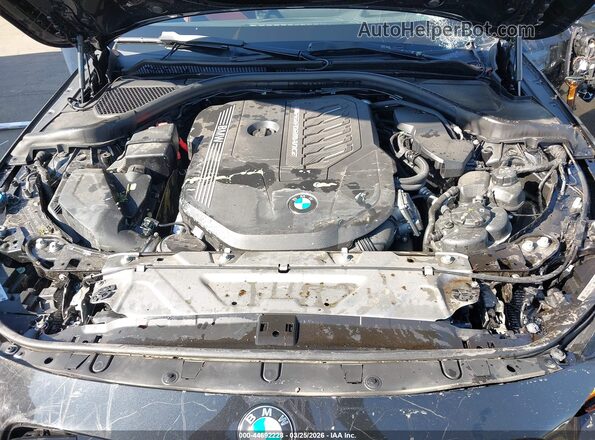 3MW53CM03P8D50700 2023 BMW M2 Black Rear view
