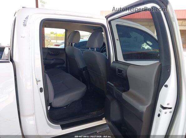 3TMCZ5ANXLM300091 2020 TOYOTA TACOMA White VIN კოდის სტიკერის ხედი