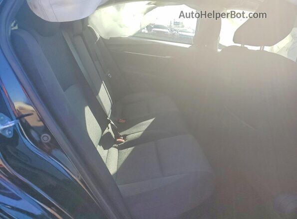 4T1DAACK5SU557740 2025 TOYOTA LE Black Vista de los asientos traseros