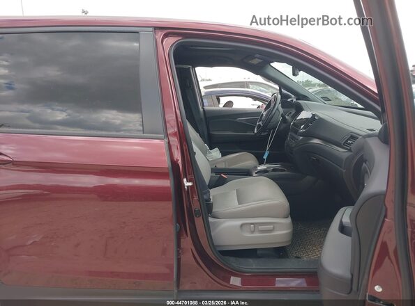 5FNYF7H58MB010356 2021 HONDA PASSPORT Red Widok wnętrza z przodu