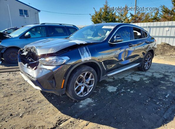 5UX33DT07R9V93371 2024 BMW X4 Black Vista tres cuartos delantera izquierda