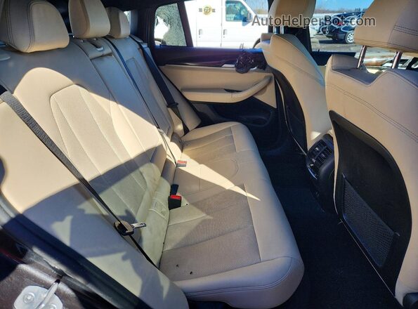 5UX33DT07R9V93371 2024 BMW X4 Black Vista interior trasera