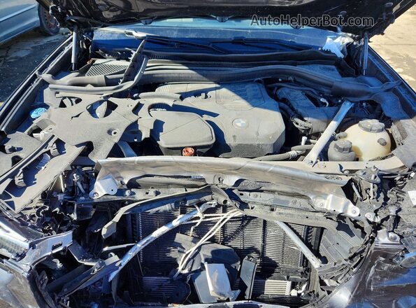 5UX33DT07R9V93371 2024 BMW X4 Black Vista del compartimento del motor