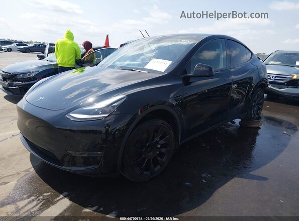 7SAYGAEE4PF759550 2023 TESLA MODEL Y Black წინა მარცხენა ხედი სამი მეოთხედიდან