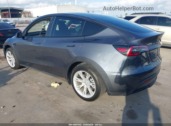 7SAYGDED1PF956099 2023 TESLA MODEL Y Gray Trasero izquierdo