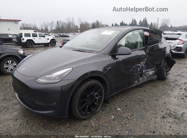 7SAYGDEE7SF247825 2025 TESLA MODEL Y Gray წინა მარცხენა ხედი სამი მეოთხედიდან