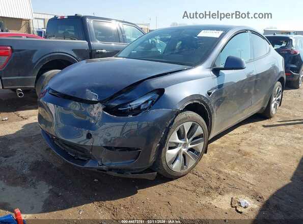 7SAYGDEE8PA085725 2023 TESLA MODEL Y Gray Przód lewy