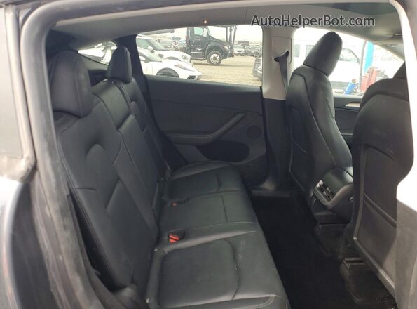 7SAYGDEE8PA211064 2023 TESLA MODEL Угольный Вид задней части салона
