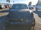 2024 Tesla Model Y Black vin: 7SAYGDEEXRA236129