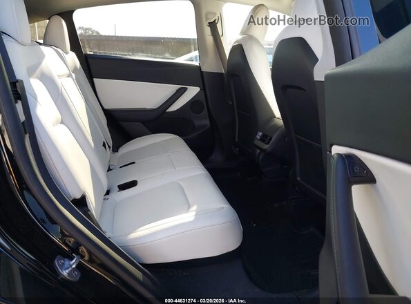 7SAYGDEF1NF392727 2022 TESLA MODEL Y Black VIN კოდის სტიკერის ხედი
