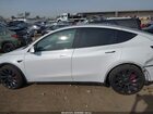 2024 Tesla Model Y Performance Dual Motor All-wheel Drive White vin: 7SAYGDEF9RF061075