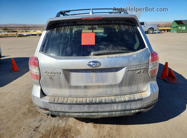 JF2SJGVC0GH538566 2016 SUBARU FORESTER Silver Вид ззаду