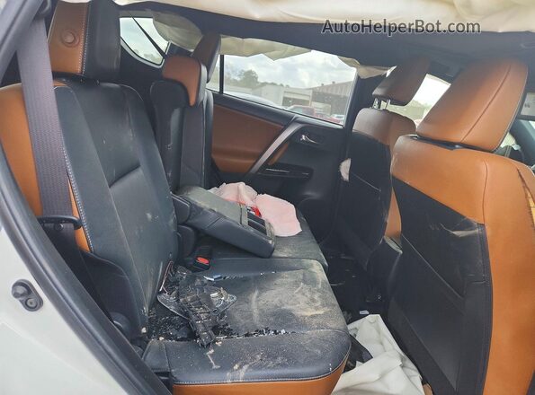 JTMNFREVXGJ090078 2016 TOYOTA RAV4 Белый Вид задней части салона
