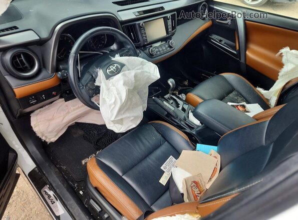 JTMNFREVXGJ090078 2016 TOYOTA RAV4 Белый Вид панели приборов
