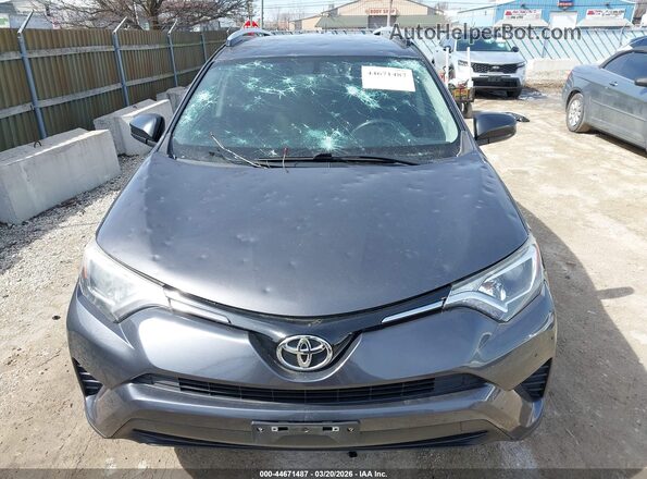 JTMZFREV4GJ080647 2016 TOYOTA LE Gray Front view