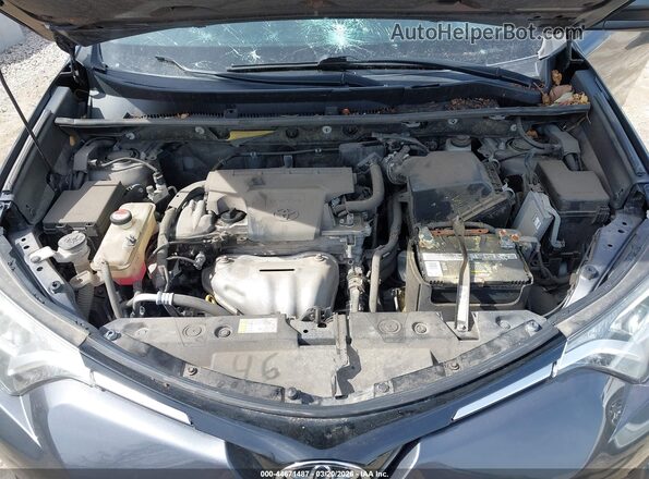 JTMZFREV4GJ080647 2016 TOYOTA LE Gray Rear view