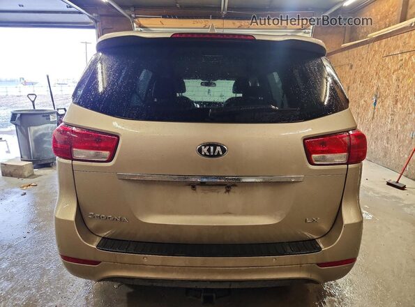 KNDMB5C16H6279802 2017 KIA SEDONA Золотой Вид салона спереди