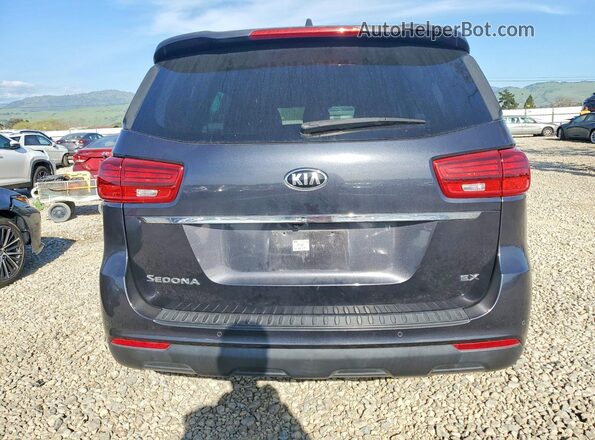 KNDMB5C17K6532780 2019 KIA SEDONA Gray Rear view