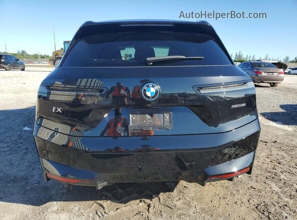 WB523CF02SCT46332 2025 BMW IX Black Vista trasera
