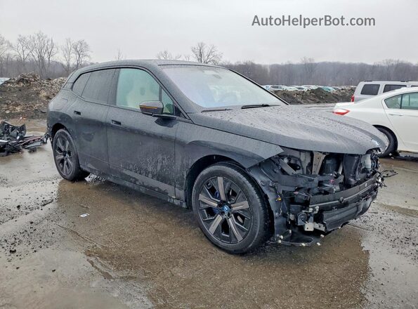 WB523CF06RCR64893 2024 BMW IX Черный Передняя правая четверть