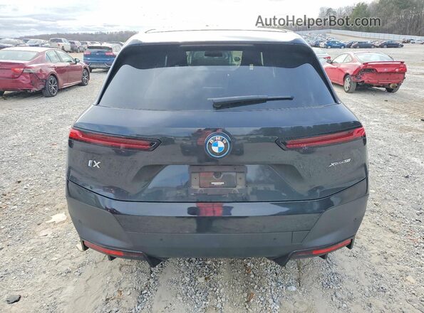 WB523CF09PCL65340 2023 BMW IX Black Vista trasera
