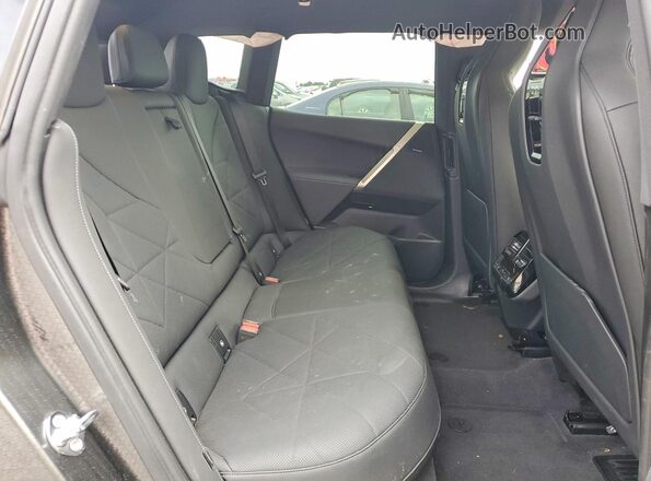 WB523CF09PCL65340 2023 BMW IX Black Vista interior trasera
