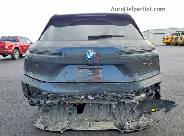 WB533CF04SCT56283 2025 BMW IX Charcoal უკანა ხედი