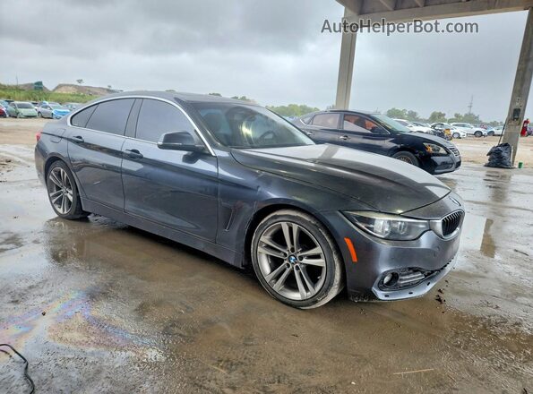 WBA4J1C57KBM12898 2019 BMW OTHER Серый Вид спереди