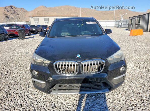 WBXHT3C34G5E50335 2016 BMW X1 Black Widok z przodu