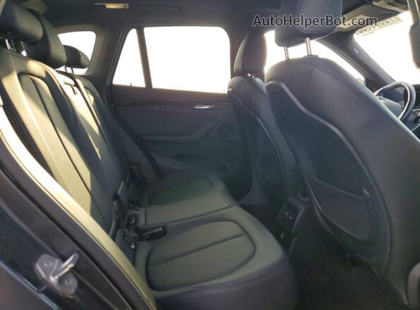 WBXHT3C38G5F66332 2016 BMW X1 Gray Vista de los asientos traseros