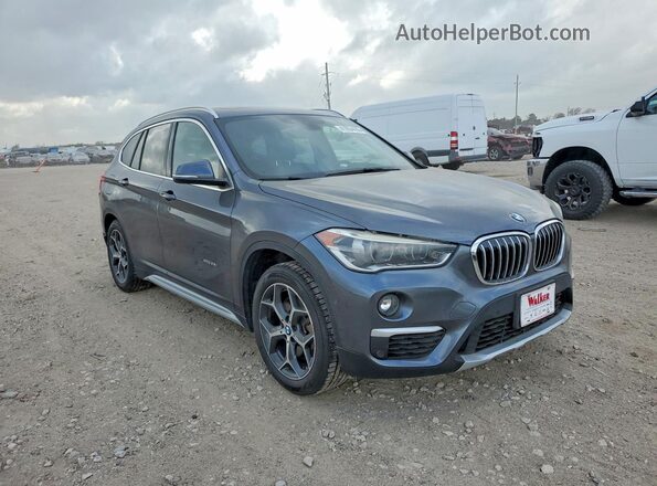 WBXHT3C38H5F82533 2017 BMW X1 Серый Передняя правая четверть