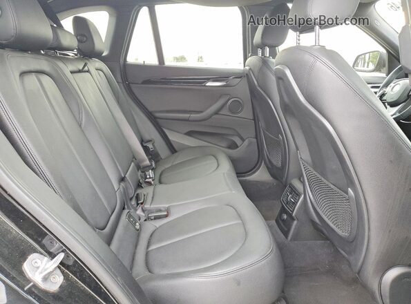 WBXHT3Z34G4A48778 2016 BMW X1 Black Widok wnętrza z tyłu