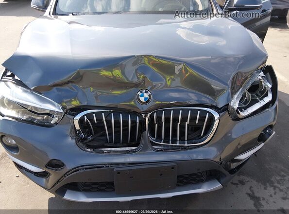 WBXHT3Z36H4A65695 2017 BMW X1 Серый Вид спереди